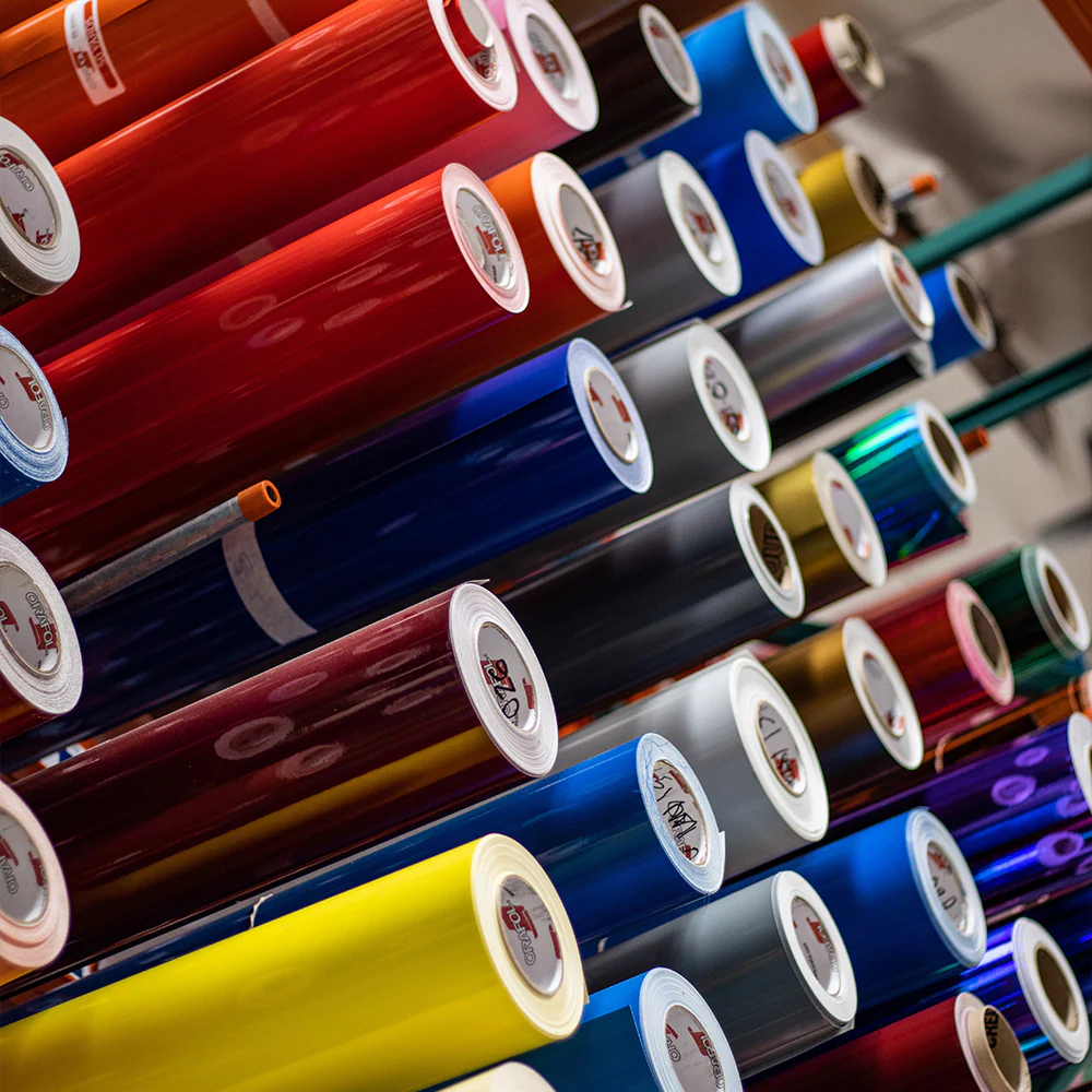 A large amount of rolls of colored paper